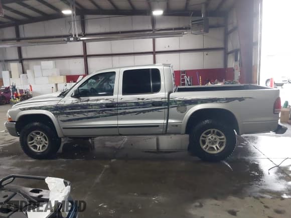 ✅ 2004 Dodge Dakota SLT • VIN: 1D7HG48N64S523528 • Lot: 41199575. Wystawiony na IAAI z przebiegiem 261 239 mil. Bezpłatny archiwum sprzedaży aukcyjnych z USA i szczegółowy raport historii pojazdu na DreamBid. Zdjęcie 14.