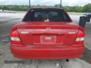 ✅ 1999 Mazda Protege DX • VIN: JM1BJ222XX0118051 • Lot: 57821805. Wystawiony na Copart z przebiegiem 299 504 mil. Bezpłatny archiwum sprzedaży aukcyjnych z USA i szczegółowy raport historii pojazdu na DreamBid. Zdjęcie 6.