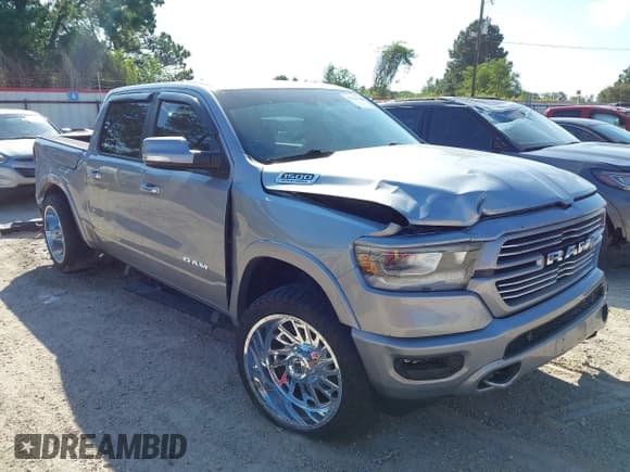 ✅ 2022 Ram 1500 Laramie • VIN: 1C6RREJTXNN125172 • Lot: 43329494. Listed on IAAI with 126,637 mi. Free auction sales archive from the USA and detailed vehicle history report at DreamBid. Image 1.