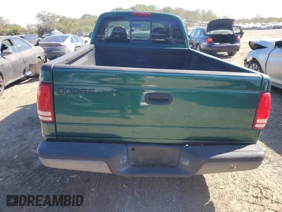 2003 Dodge Dakota z VIN 1D7HG12X43S300072, wystawiony jako Copart lot #75344104 z przebiegiem 235 456 mil mil oraz Szkoda całkowita • Salvage title. Historia ofert i sprzedaży dostępna na DreamBid. Obrazek 6.