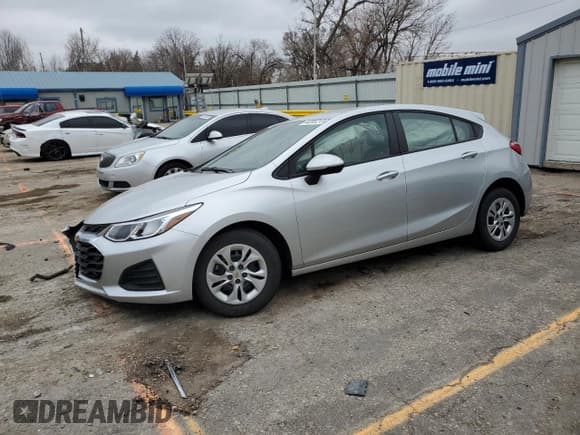✅ 2019 Chevrolet Cruze LS • VIN: 3G1BC6SM0KS604610 • Lot: 44205213. Listed on Copart with 19,879 mi. Free auction sales archive from the USA and detailed vehicle history report at DreamBid. Image 1.