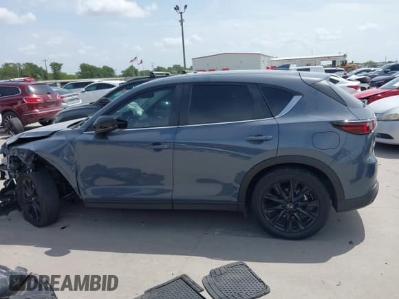 ✅ 2023 Mazda CX-5 S Carbon Edition • VIN: JM3KFBCMXP0136901 • Lot: 42630209. Listed on IAAI with 22,519 mi. Free auction sales archive from the USA and detailed vehicle history report at DreamBid. Image 13.