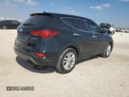 ✅ 2018 Hyundai Santa Fe 2.0T • VIN: 5XYZU4LAXJG548963 • Лот: 82633375. Опубликован ранее на Copart с пробегом 95 041 миль. Бесплатный доступ к архиву аукционных продаж из США и подробный отчёт об истории автомобиля на DreamBid. Изображение 3.
