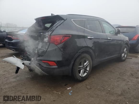 ✅ 2018 Hyundai Santa Fe 2.4L • VIN: 5XYZUDLB0JG512949 • Лот: 39501394. Опубликован ранее на Copart с пробегом 89 092 миль. Бесплатный доступ к архиву аукционных продаж из США и подробный отчёт об истории автомобиля на DreamBid. Изображение 3.