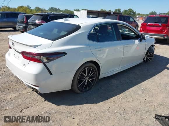 2023 Toyota Camry SE with VIN 4T1G11BK6PU100117, listed as a IAAI auction lot 43194290 with 54,061 mi miles and . Bid and sale history available at DreamBid. Image 4.