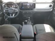 ✅ 2024 Jeep Wrangler Sahara • VIN: 1C4RJXP62RW228115 • Lot: 69132165. Listed on Copart with 6,032 mi. Free auction sales archive from the USA and detailed vehicle history report at DreamBid. Image 8.