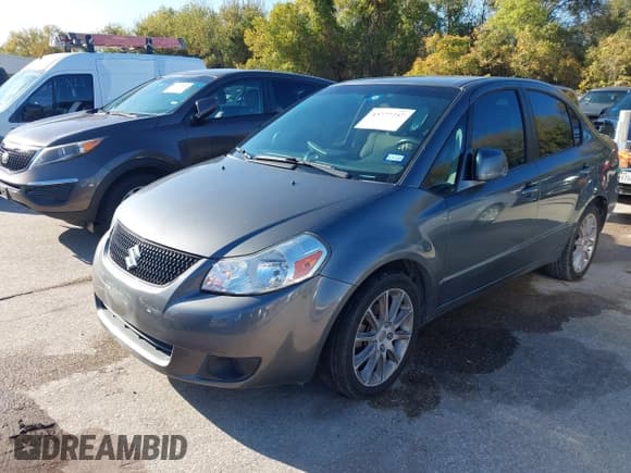 ✅ 2011 Suzuki SX4 LE • VIN: JS2YC5A21B6303589 • Lot: 43777757. Wystawiony na IAAI z przebiegiem 186 223 mil. Bezpłatny archiwum sprzedaży aukcyjnych z USA i szczegółowy raport historii pojazdu na DreamBid. Zdjęcie 2.