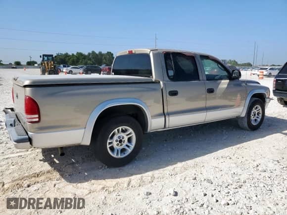 2002 Dodge Dakota SLT z VIN 1B7HL48XX2S693282, wystawiony jako Copart lot #66738085 z przebiegiem 142 180 mil mil oraz Czysty tytuł • Clean title. Historia ofert i sprzedaży dostępna na DreamBid. Obrazek 3.