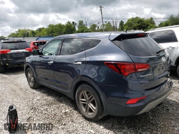 ✅ 2018 Hyundai Santa Fe 2.4L • VIN: 5NMZT3LB7JH094618 • Лот: 63293583. Опубликован ранее на Copart с пробегом 93 587 миль. Бесплатный доступ к архиву аукционных продаж из США и подробный отчёт об истории автомобиля на DreamBid. Изображение 2.