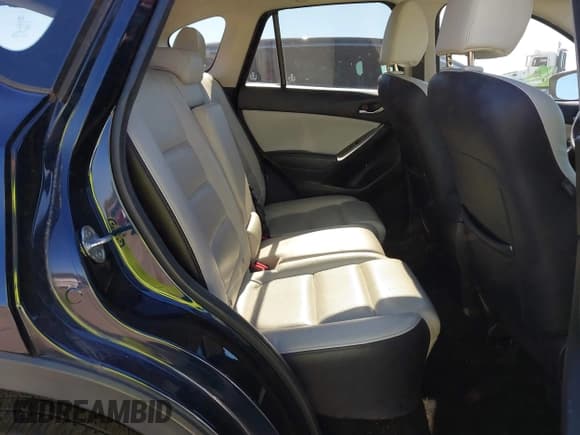 ✅ 2016 Mazda CX-5 Grand Touring • VIN: JM3KE2DY5G0715623 • Lot: 43582561. Wystawiony na IAAI z przebiegiem 166 935 mil. Bezpłatny archiwum sprzedaży aukcyjnych z USA i szczegółowy raport historii pojazdu na DreamBid. Zdjęcie 8.