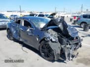 ✅ 2015 Tesla Model S 85 • VIN: 5YJSA1E18FF104436 • Lot: 42686314. Listed on IAAI with 179,459 mi. Free auction sales archive from the USA and detailed vehicle history report at DreamBid. Image 1.