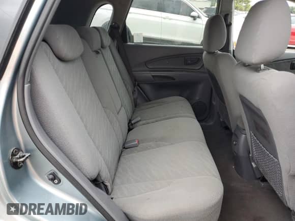 2005 Hyundai Tucson GL z VIN KM8JM12B65U184708, wystawiony jako Copart lot #73351044 z przebiegiem 209 563 mil mil oraz Szkoda całkowita • Salvage title. Historia ofert i sprzedaży dostępna na DreamBid. Obrazek 11.