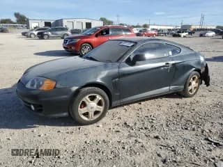 ✅ 2004 Hyundai Tiburon • VIN: KMHHM65D44U128600 • Лот: 92377005. Опубликован ранее на Copart с пробегом 336 484 миль. Бесплатный доступ к архиву аукционных продаж из США и подробный отчёт об истории автомобиля на DreamBid. Изображение 1.