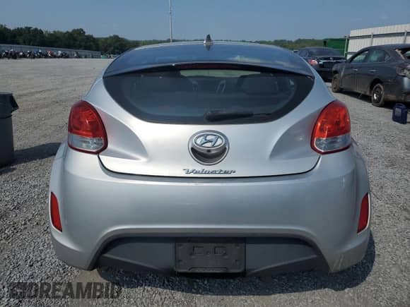 2014 Hyundai Veloster z VIN KMHTC6AD1EU183378, wystawiony jako Copart lot #67775904 z przebiegiem 121 477 mil mil oraz Szkoda całkowita • Salvage title. Historia ofert i sprzedaży dostępna na DreamBid. Obrazek 6.