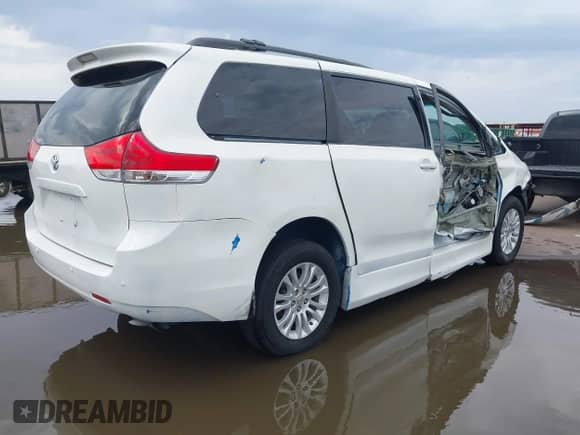 2011 Toyota Sienna XLE AAS with VIN 5TDYK3DC1BS106301, listed as a IAAI auction lot 43423294 with 158,803 mi miles and . Bid and sale history available at DreamBid. Image 4.