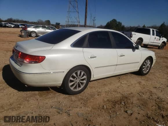 2006 Hyundai Azera SE z VIN KMHFC46F46A134061, wystawiony jako Copart lot #87227344 z przebiegiem 224 496 mil mil oraz Szkoda całkowita • Salvage title. Historia ofert i sprzedaży dostępna na DreamBid. Obrazek 3.