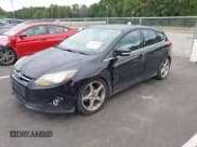 ✅ 2014 Ford Focus Titanium • VIN: 1FADP3N27EL114825 • Lot: 43217005. Listed on IAAI with 148,002 mi. Free auction sales archive from the USA and detailed vehicle history report at DreamBid. Image 2.