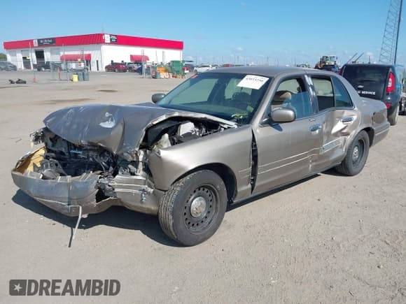 ✅ 2001 Ford Crown Victoria • VIN: 2FAFP73W01X131209 • Lot: 43033250. Listed on IAAI with 241,898 mi. Free auction sales archive from the USA and detailed vehicle history report at DreamBid. Image 2.