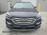 ✅ 2017 Hyundai Santa Fe 2.0T • VIN: 5XYZUDLA1HG495970 • Lot: 92159705. Listed on Copart with 68,332 mi. Free auction sales archive from the USA and detailed vehicle history report at DreamBid. Image 5.