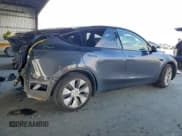 ✅ 2023 Tesla Model Y Long Range • VIN: 7SAYGAEE0PF911100 • Lot: 94993705. Wystawiony na Copart z przebiegiem 24 976 mil. Bezpłatny archiwum sprzedaży aukcyjnych z USA i szczegółowy raport historii pojazdu na DreamBid. Zdjęcie 3.