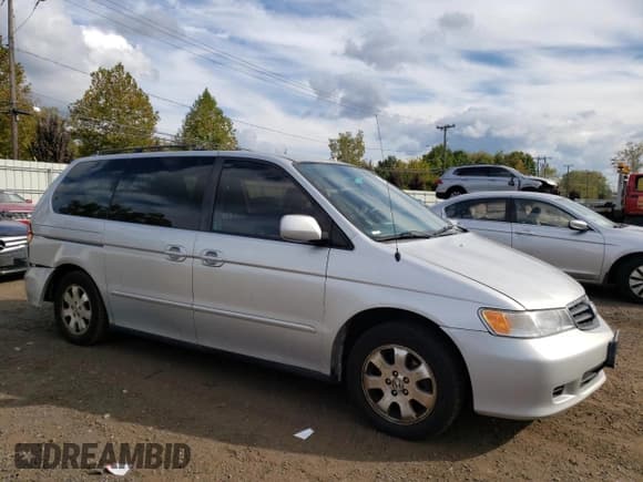 ✅ 2004 Honda Odyssey EX-L • VIN: 5FNRL18774B094620 • Lot: 73986354. Listed on Copart with 201,621 mi. Free auction sales archive from the USA and detailed vehicle history report at DreamBid. Image 4.
