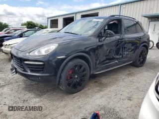 ✅ 2012 Porsche Cayenne Turbo • VIN: WP1AC2A24CLA80332 • Lot: 67294265. Listed on Copart with 105,610 mi. Free auction sales archive from the USA and detailed vehicle history report at DreamBid. Image 1.