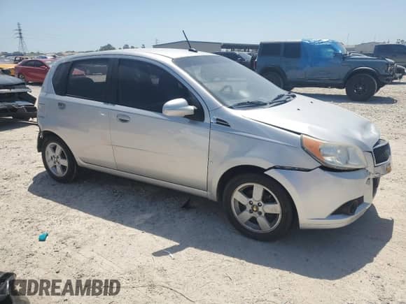 2009 Chevrolet Aveo 1LT with VIN KL1TD66E09B338773, listed as a Copart auction lot 52575765 with 102,617 mi miles and Salvage title. Bid and sale history available at DreamBid. Image 4.