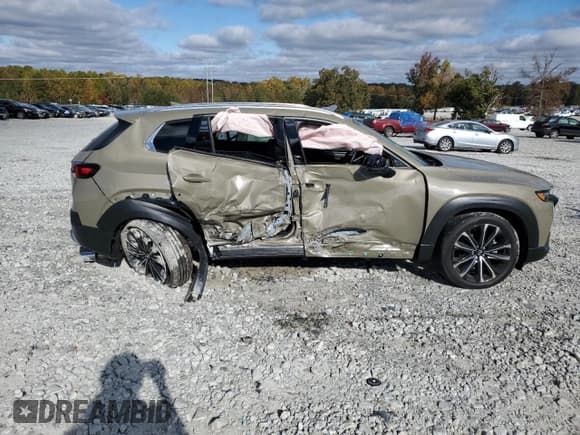 ✅ 2023 Mazda CX-50 Premium • VIN: 7MMVABDY7PN111138 • Lot: 64731582. Wystawiony na Copart z przebiegiem 3 917 mil. Bezpłatny archiwum sprzedaży aukcyjnych z USA i szczegółowy raport historii pojazdu na DreamBid. Zdjęcie 9.
