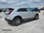 ✅ 2022 Cadillac XT4 FWD Premium Luxury • VIN: 1GYFZCR48NF100160 • Lot: 69571625. Listed on Copart with 66,265 mi. Free auction sales archive from the USA and detailed vehicle history report at DreamBid. Image 3.