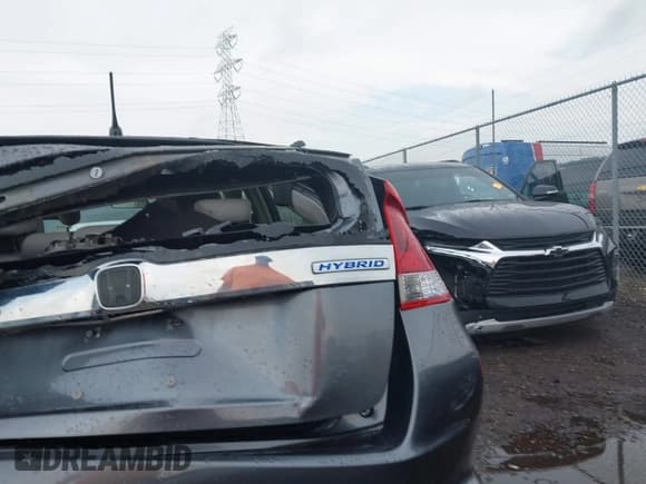 ✅ 2014 Honda Insight LX • VIN: JHMZE2H54ES000081 • Lot: 42622054. Listed on IAAI with 30,097 mi. Free auction sales archive from the USA and detailed vehicle history report at DreamBid. Image 21.