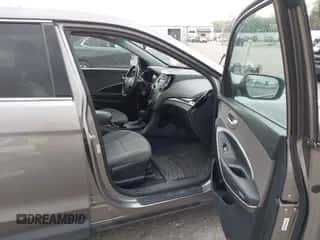 2015 Hyundai Santa Fe z VIN 5XYZTDLB3FG250726, wystawiony jako IAAI lot #43108562 z przebiegiem 178 355 mil mil oraz . Historia ofert i sprzedaży dostępna na DreamBid. Obrazek 5.