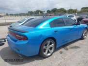 ✅ 2015 Dodge Charger SXT • VIN: 2C3CDXHG3FH827754 • Lot: 42012425. Listed on IAAI with 119,057 mi. Free auction sales archive from the USA and detailed vehicle history report at DreamBid. Image 4.