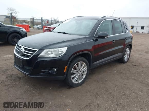 ✅ 2011 Volkswagen Tiguan S • VIN: WVGBV7AX1BW521660 • Lot: 43797872. Listed on IAAI with 143,107 mi. Free auction sales archive from the USA and detailed vehicle history report at DreamBid. Image 2.