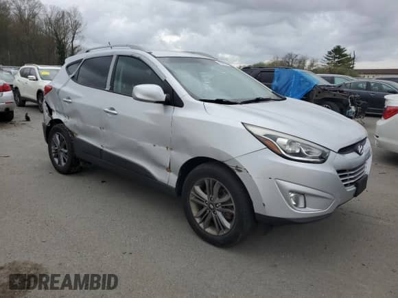 2014 Hyundai Tucson SE with VIN KM8JU3AG7EU801588, listed as a Copart auction lot 49886364 with 133,636 mi miles and Salvage title. Bid and sale history available at DreamBid. Image 4.