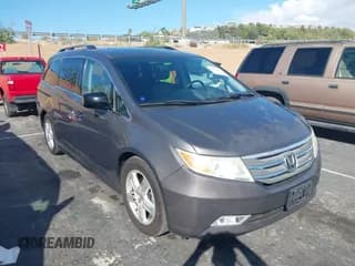 ✅ 2013 Honda Odyssey Touring • VIN: 5FNRL5H92DB013273 • Lot: 43402682. Listed on IAAI with 125,776 mi. Free auction sales archive from the USA and detailed vehicle history report at DreamBid. Image 1.