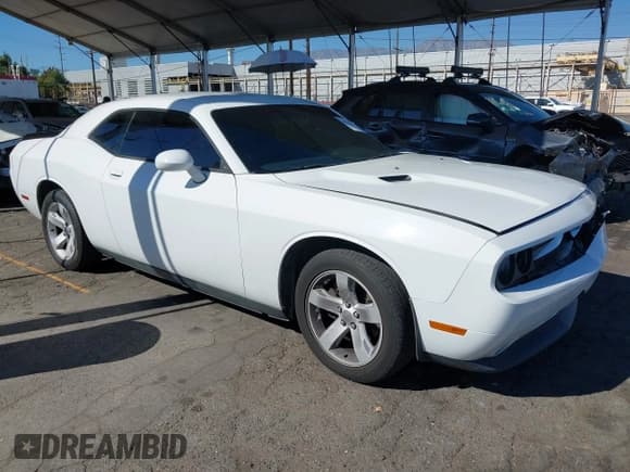 ✅ 2014 Dodge Challenger SXT • VIN: 2C3CDYAG1EH267067 • Lot: 43548030. Listed on IAAI with 192,693 mi. Free auction sales archive from the USA and detailed vehicle history report at DreamBid. Image 1.