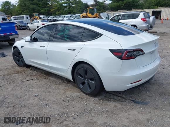 ✅ 2021 Tesla Model 3 Standard Range Plus • VIN: 5YJ3E1EA6MF052276 • Lot: 43164101. Listed on IAAI with 26,101 mi. Free auction sales archive from the USA and detailed vehicle history report at DreamBid. Image 3.