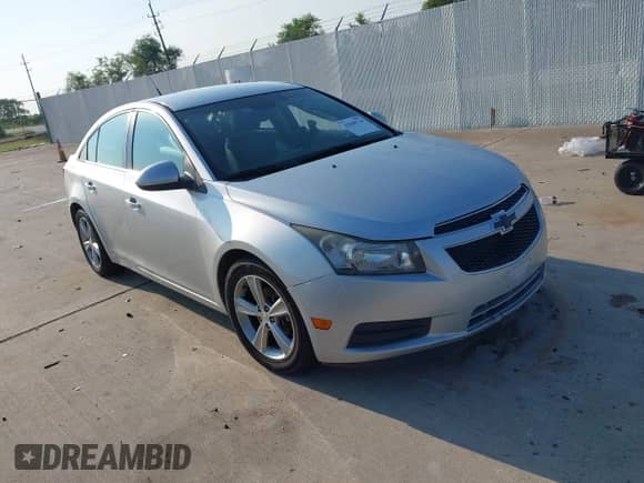 2014 Chevrolet Cruze 2LT with VIN 1G1PE5SB1E7372384, listed as a IAAI auction lot 43048716 with 153,863 mi miles and . Bid and sale history available at DreamBid. Image 1.