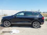 ✅ 2016 Volkswagen Touareg Lux • VIN: WVGEF9BP6GD011893 • Lot: 42772659. Listed on IAAI with 128,237 mi. Free auction sales archive from the USA and detailed vehicle history report at DreamBid. Image 14.