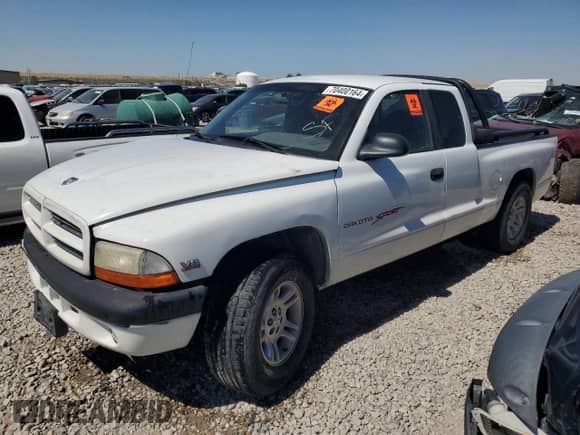 1999 Dodge Dakota SLT z VIN 1B7GL22Y6XS108819, wystawiony jako Copart lot #70400164 z przebiegiem Nie podano mil oraz Szkoda całkowita • Salvage title. Historia ofert i sprzedaży dostępna na DreamBid. Obrazek 1.