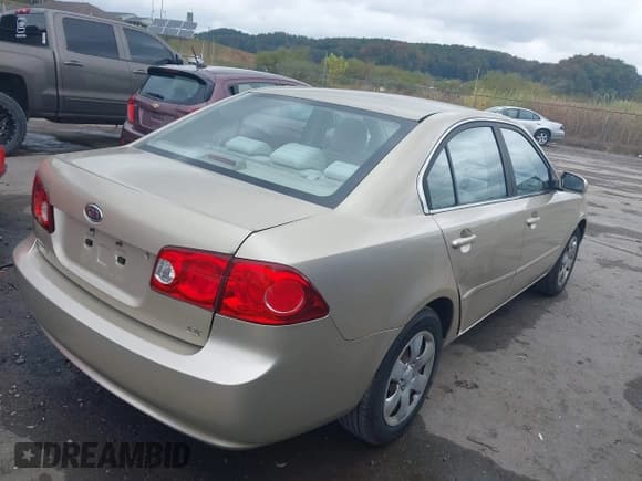 ✅ 2006 Kia Optima LX • VIN: KNAGE123965033553 • Lot: 43249124. Listed on IAAI with 128,780 mi. Free auction sales archive from the USA and detailed vehicle history report at DreamBid. Image 4.
