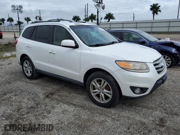 ✅ 2012 Hyundai Santa Fe Limited • VIN: 5XYZKDAG1CG143185 • Lot: 74531934. Listed on Copart with 186,312 mi. Free auction sales archive from the USA and detailed vehicle history report at DreamBid. Image 4.