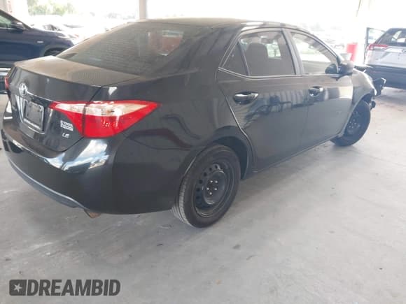 ✅ 2018 Toyota Corolla SE • VIN: 5YFBURHE1JP850129 • Lot: 43533931. Listed on IAAI with 374,360 mi. Free auction sales archive from the USA and detailed vehicle history report at DreamBid. Image 4.