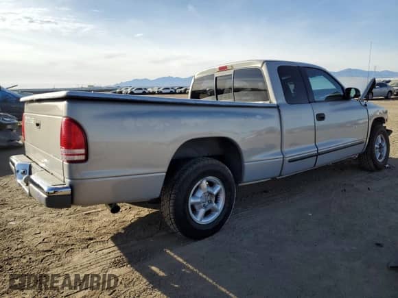 1998 Dodge Dakota SLT z VIN 1B7GL22Y6WS549252, wystawiony jako Copart lot #86925244 z przebiegiem 246 913 mil mil oraz Szkoda całkowita • Salvage title. Historia ofert i sprzedaży dostępna na DreamBid. Obrazek 3.