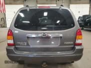 ✅ 2003 Mazda Tribute LX • VIN: 4F2YZ04173KM05549 • Lot: 86702895. Listed on Copart with 128,757 mi. Free auction sales archive from the USA and detailed vehicle history report at DreamBid. Image 6.