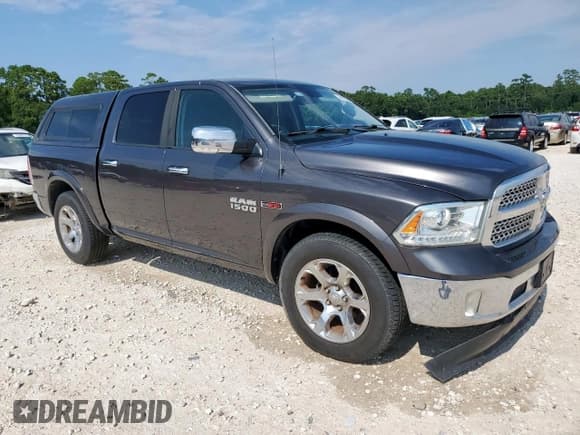 ✅ 2015 Ram 1500 Laramie • VIN: 1C6RR6NM6FS521272 • Lot: 69978965. Listed on Copart with 226,243 mi. Free auction sales archive from the USA and detailed vehicle history report at DreamBid. Image 4.