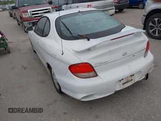 2000 Hyundai Tiburon z VIN KMHJG35F6YU167638, wystawiony jako IAAI lot #42335613 z przebiegiem 254 361 mil mil oraz . Historia ofert i sprzedaży dostępna na DreamBid. Obrazek 3.