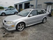 ✅ 2003 Mazda Protege • VIN: JM1BJ245131200147 • Lot: 62848564. Listed on Copart with 141,556 mi. Free auction sales archive from the USA and detailed vehicle history report at DreamBid. Image 1.