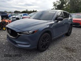 ✅ 2021 Mazda CX-5 Carbon Edition • VIN: JM3KFACYXM0385157 • Lot: 71257055. Listed on Copart with 95,250 mi. Free auction sales archive from the USA and detailed vehicle history report at DreamBid. Image 1.