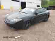 2007 Hyundai Tiburon GT z VIN KMHHN66F37U250320, wystawiony jako IAAI lot #42047654 z przebiegiem 231 899 mil mil oraz . Historia ofert i sprzedaży dostępna na DreamBid. Obrazek 2.